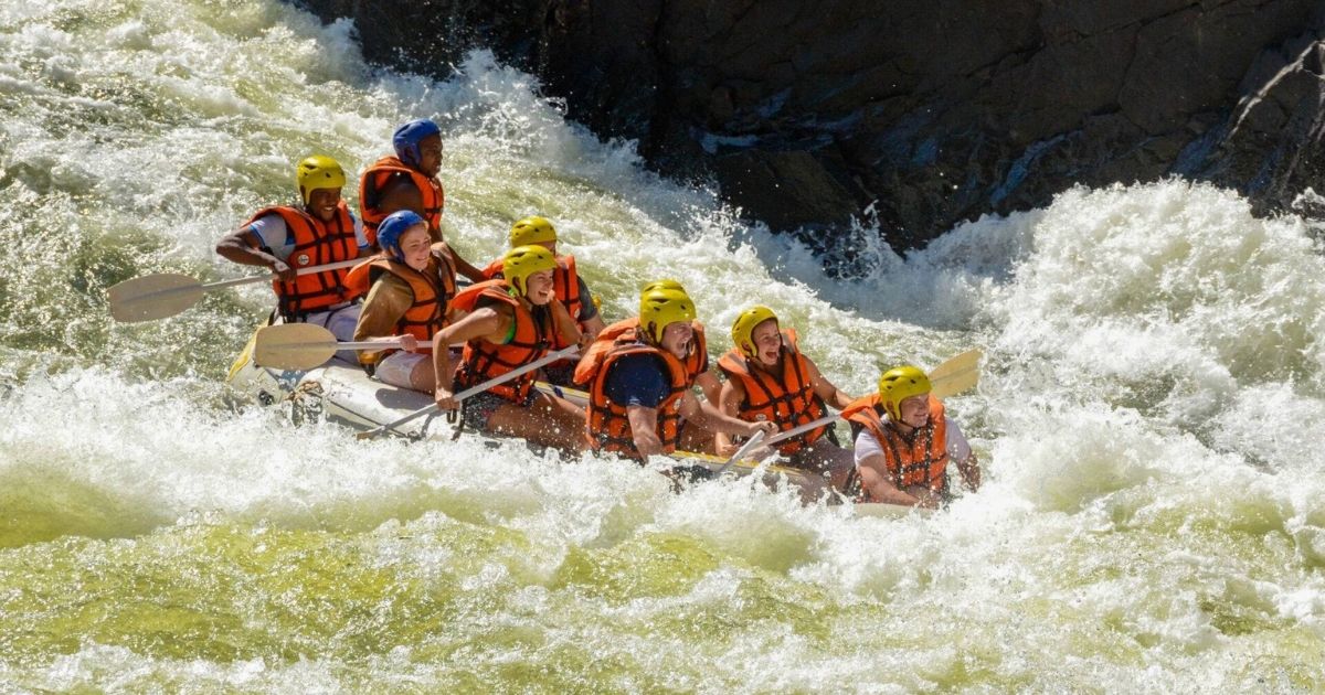 Raft navigating grade five rapids in the Batoka Gorge on the Zambezi River